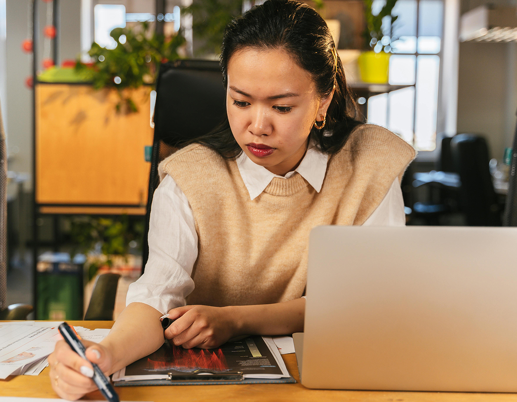 Offshore professional working on a task at their office workstation